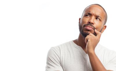 A man thinking about his dental insurance options