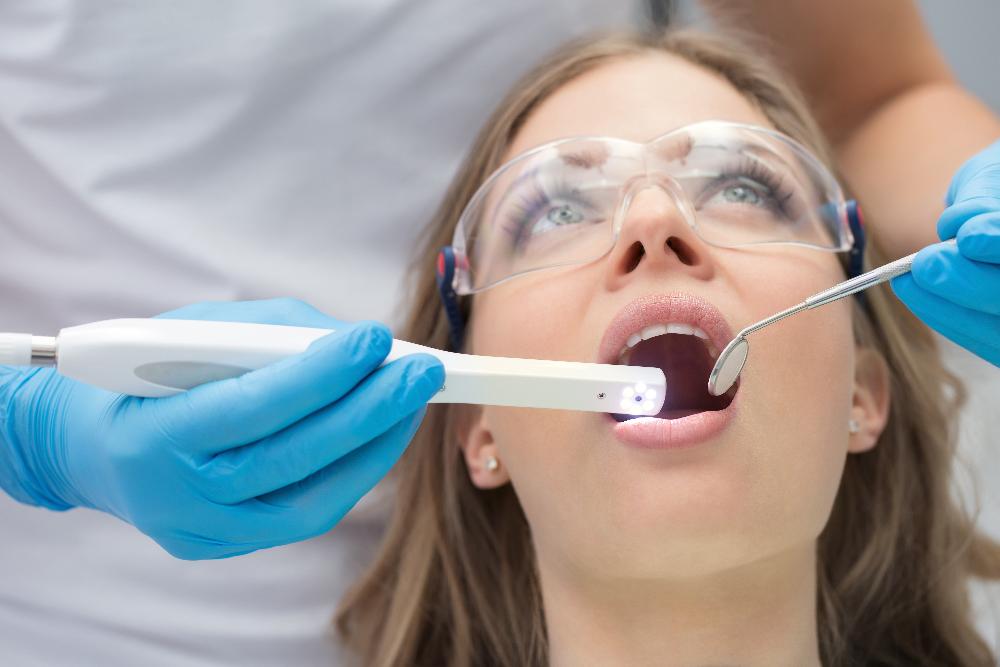 woman receiving exam with dental technology | wilmington de dentist