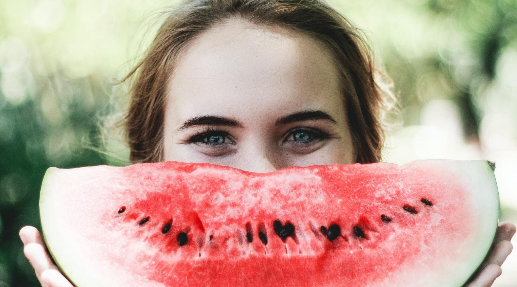 woman eating watermelon l dentist pike creek