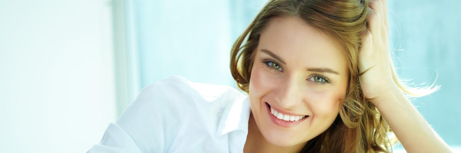 woman with blonde hair smiling l family dentist wilmington de