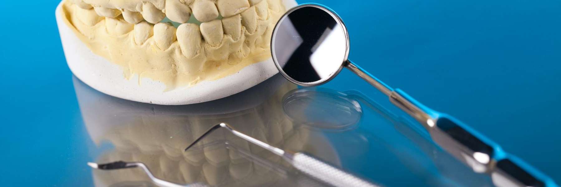 A tooth mold and dental cleaning tools