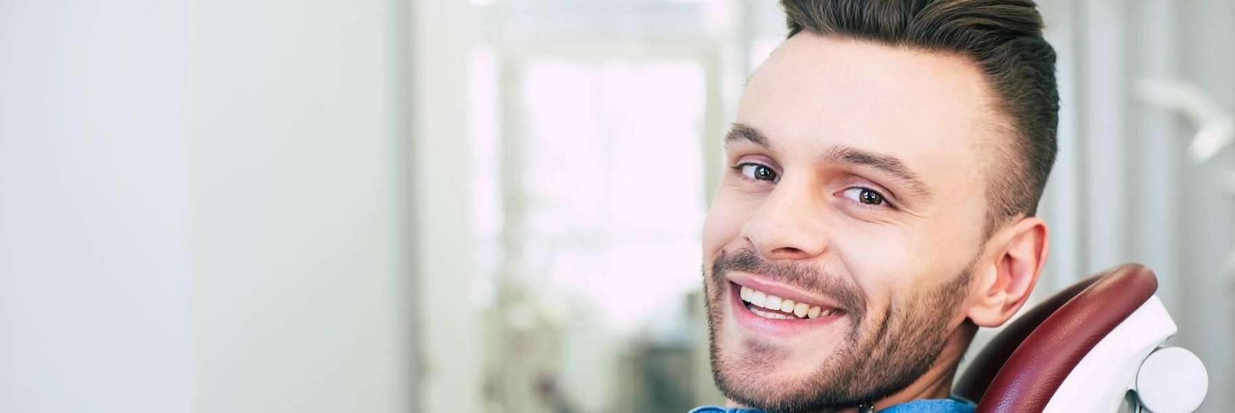 A smiling man at the dentist's office