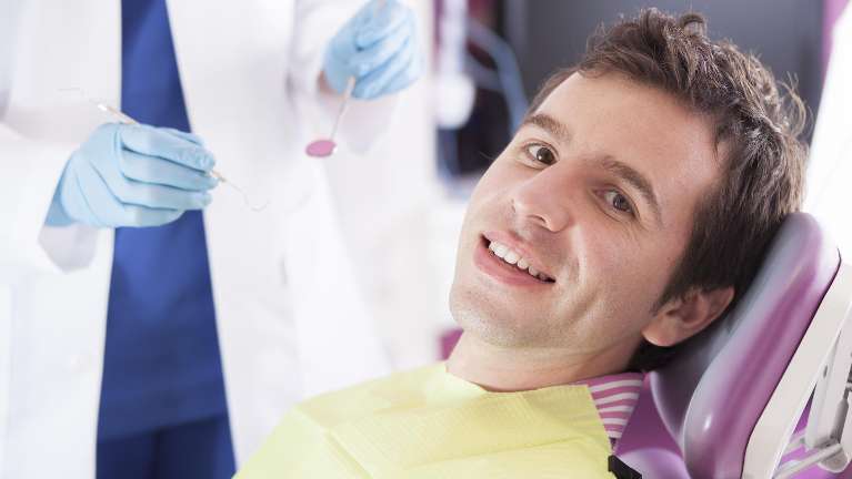 A man getting a dental exam | dentist Wilmington Delaware
