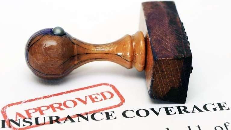 An approved stamp on an insurance coverage form