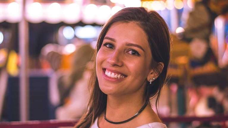 A woman with straight teeth smiling | Crowns Wilmington DE