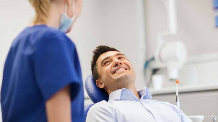 A man receiving a dental exam | TMJ treatment Wilmington, Delaware
