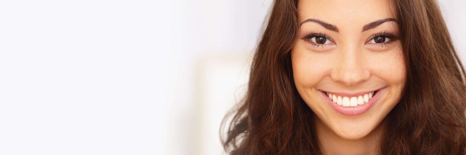 A woman smiling | dentist Wilmington, DE