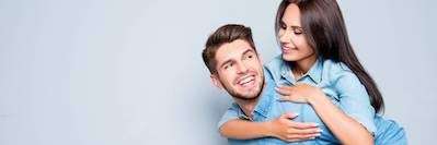 A woman hugging her husband | dentist Wilmington, DE