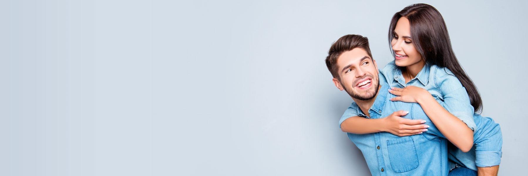 young couple hugging l invisalign wilmington