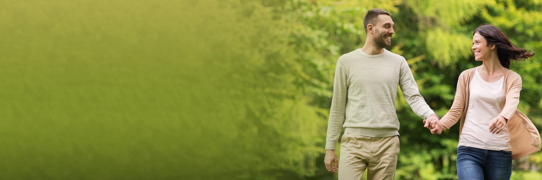 young couple walking outside l teeth whitening wilmington de